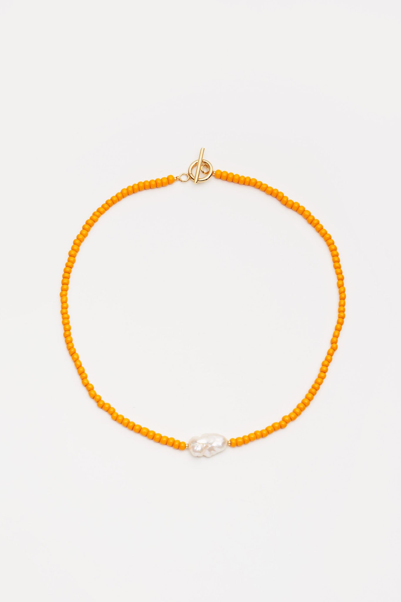 Beaded orange necklace with pearl pendant