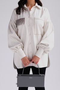 Vegan leather shirt with crystal embellishment in white