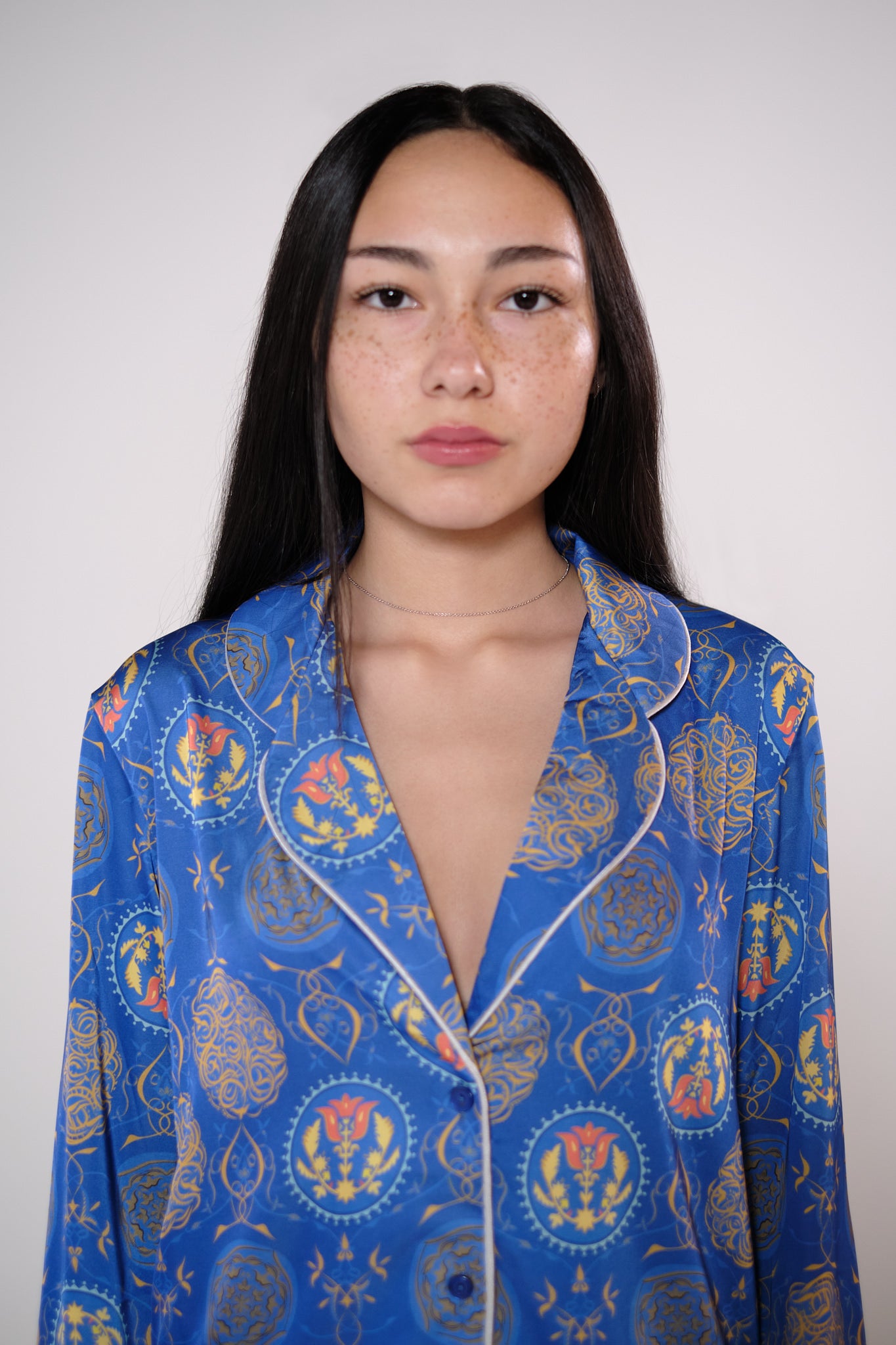 Satin long sleeve button down blouse in royal blue heritage print