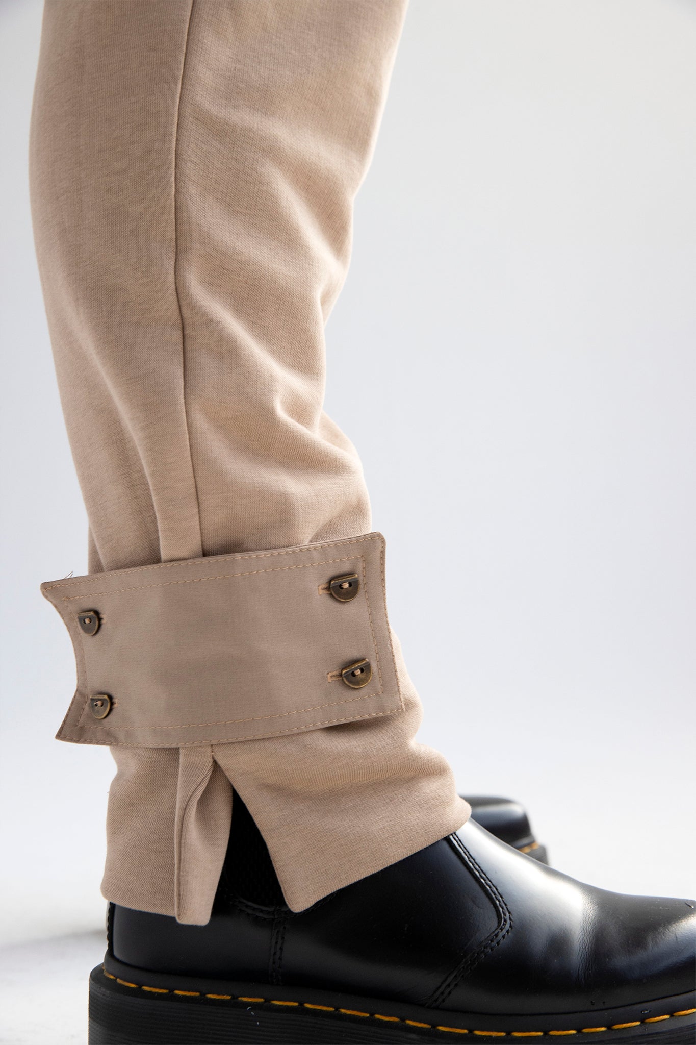 Relaxed cotton track pants with detachable tab cuffs in tan