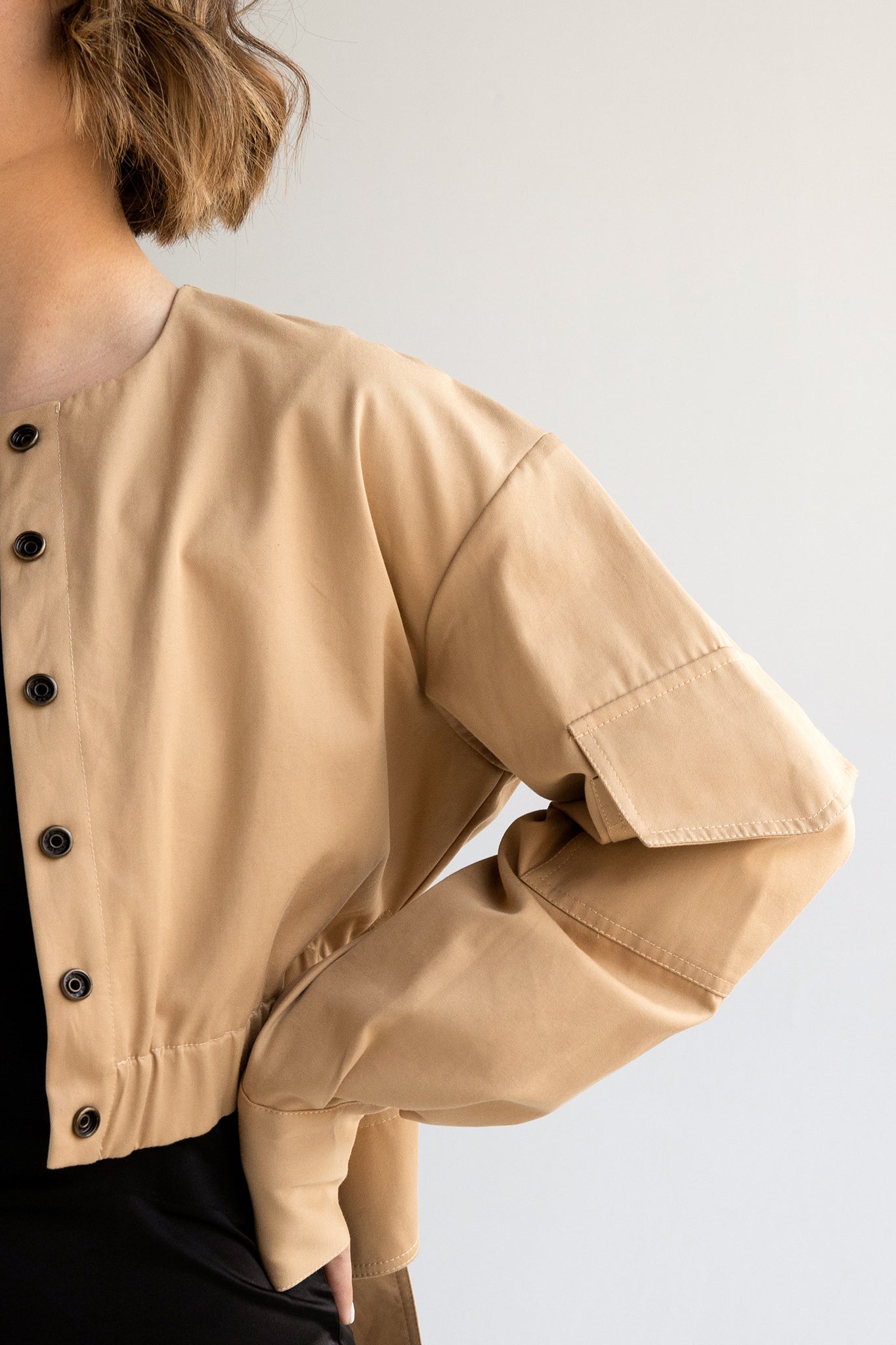 Cropped cargo jacket with wide crossover band in tan