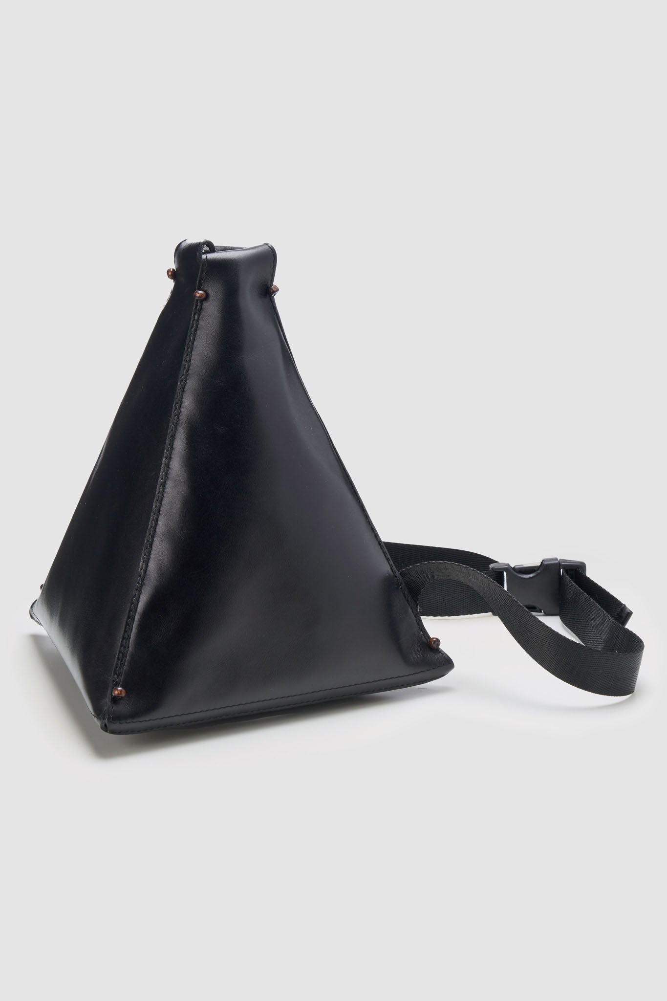 Pyramid crossbody bucket bag in black