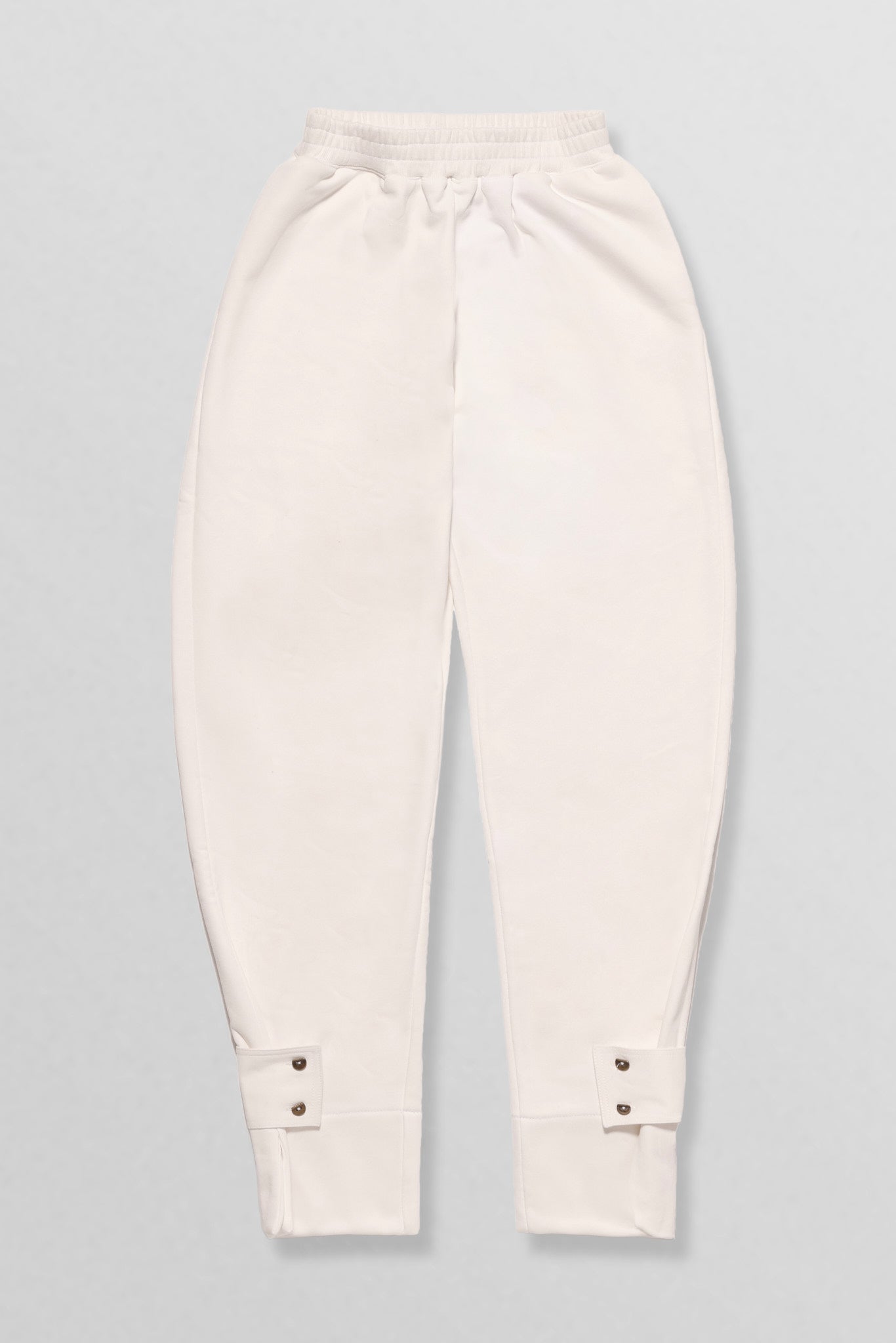Relaxed cotton track pants with detachable tab cuffs in white